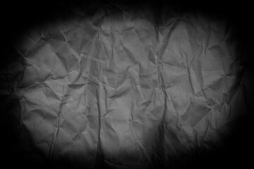 Top view empty black paper with wrinkled. Crumpled paper dark background and texture.