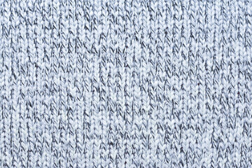 White and blue knit texture. Close up of wool material pattern. 