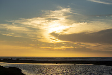 Fototapeta na wymiar Late afternoon sun over a coastline