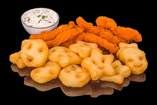 Delicious fried crispy sticks and mayonnaise sauce with reflection, isolated on black background