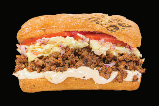 Delicious sandwiches with meat, vegetables, and sauce with reflection,