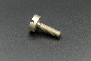 metal bolt on black background