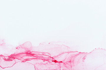 Macro close-up of abstract pink alcohol ink texture on white. Fluid ink, textured background with copy space. Vibrant color. Art for design.