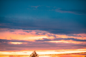 Fototapeta na wymiar Very beautiful landscape of the evening sky with clouds, sunset. Blue, orange sky.