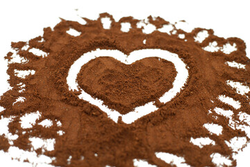 Heart drawn on ground coffee. Coffee love concept. Isolated on white.