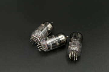 old radio tube on a black background