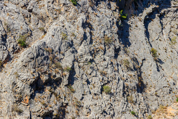 Natural texture of a mountain cliff rock for background