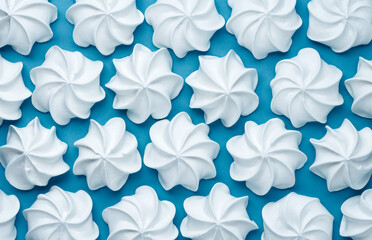 white meringues on blue background