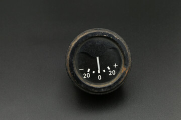 old car voltmeter on black background