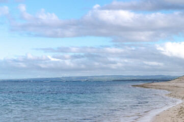 view of the beach with gray clouds