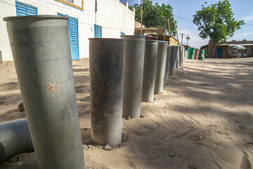 Fence made from bomb casings before the administration of the city of Fada, Chad