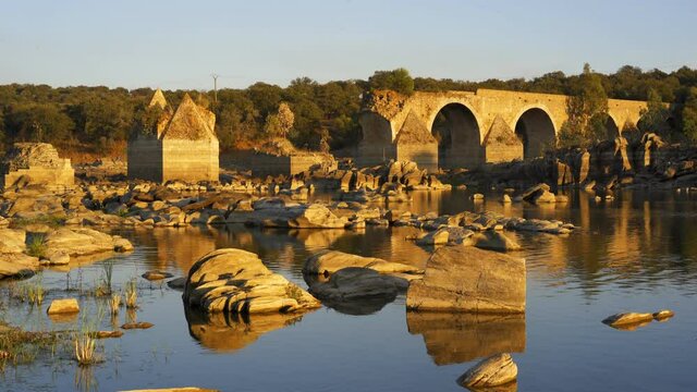 Destroyed abandoned Ajuda bridge crossing the Guadiana river between Spain and Portugal