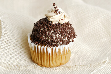 Chocolate sprinkles on cupcake for dessert food.