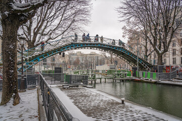 Paris, France - 01 16 2021: View of a Canal of the Basin of the villette under the snow