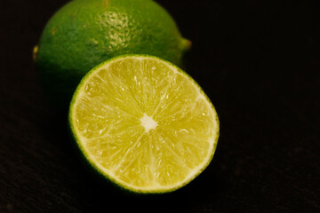 fresh lime in close up, isolated with black background