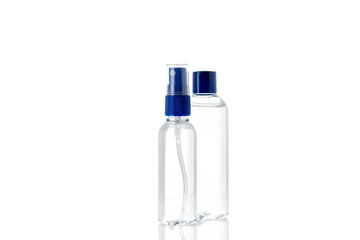 Bottles of antiseptic hand gel and spray on white background.