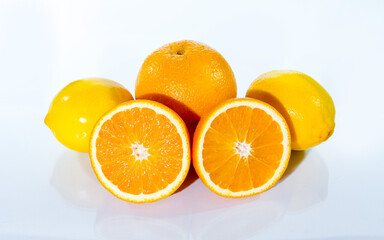 Citrus fruits (orange, lemon), red apple and banana, isolated on white