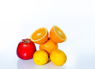 Citrus fruits (orange, lemon), red apple and banana, isolated on white