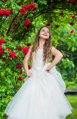 Dreamy girl ballroom dress in rose garden, supernatural fairy concept