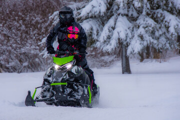 Fototapeta na wymiar Snowmobile in the Canadian winter