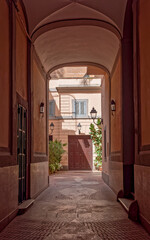 Fototapeta na wymiar Rome Italy, vintage building portico entrance and internal yard