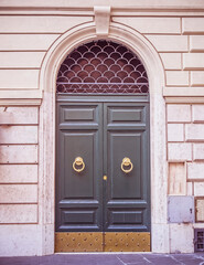 vintage residential building entrance arched door, Rome Italy
