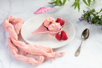 Raspberry ice-cream served in a pink bowl