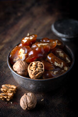 Churchkhela Pestil or Walnut Fruit Pulp in bowl on dark background.