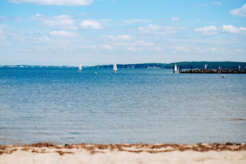 Fototapeta na wymiar The Baltic Sea with many leash sailing ships. Big blue lake with beach. Lake in Germany