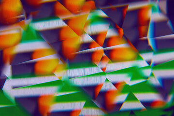 Faceted prism macro abstract background of color images on a computer monitor