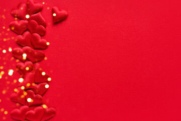 Valentines Day concept. Red hearts on a red background. Top view, copy space