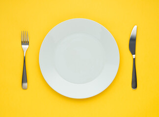 white plate on yellow background