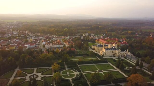 Aerial view of small town Lednice and castle yard with green gardens in Moravia, Czech Republic. UNESCO World Heritage Site.