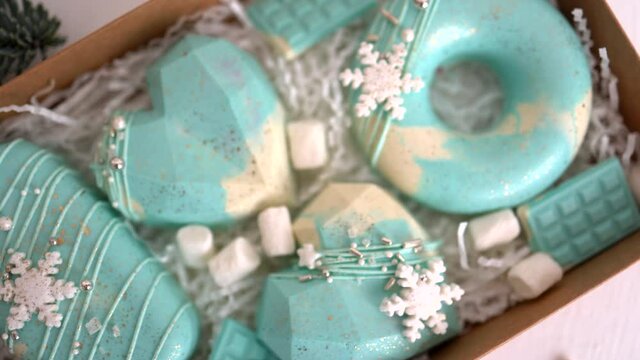 
set of blue winter cakes in a transparent box