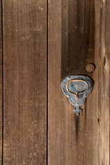 Old lock at the Russian Fort  church  with a cross on wooden copy-space and door