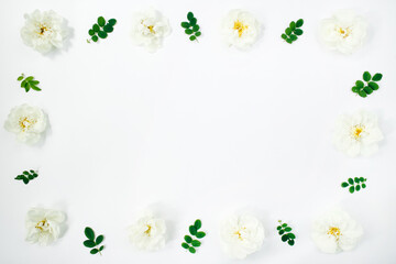 Floral composition. White flowers roses on white background. Spring, summer concept. Flat lay, top view, copy space.