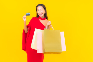 Portrait beautiful young asian woman with shopping bag and credit card