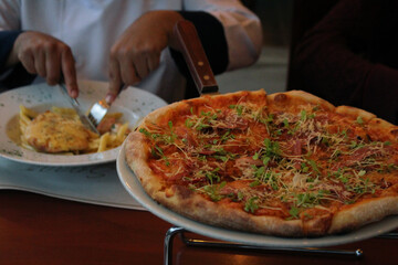 person holding pizza