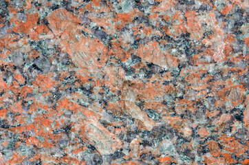 Polished red and black granite texture background.