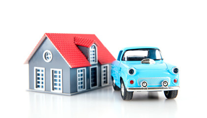 Small house model and car model on white background