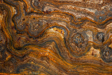 metal surface with curly rust, stains of different degrees of oxidation