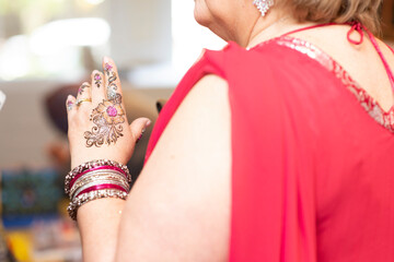 Mehendi ceremony before Indian wedding with colorful details