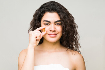 Female model holding a collagen in front of her face