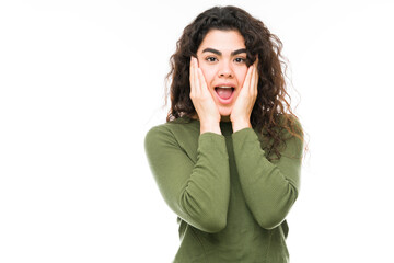 Portrait of an woman looking surprised and shocked
