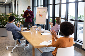 Diverse group of business people working in creative office