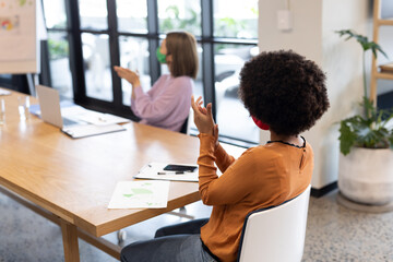 Diverse group of business people working in creative office