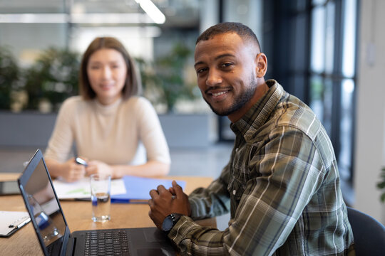 Diverse group of business people working in creative office