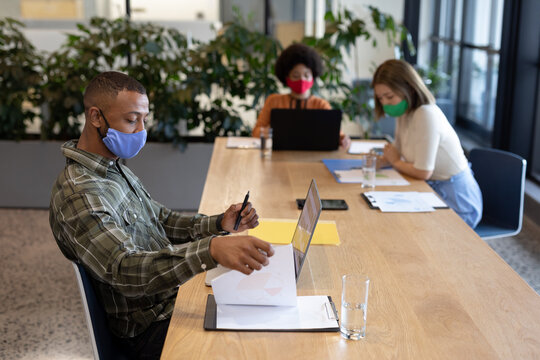 Diverse Group Of Business People Working In Creative Office