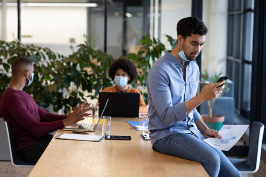 Diverse group of business people working in creative office