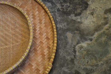 Tampah is a tool made of woven bamboo tree trunks that are split round like plates between 65-80 cm in diameter. Tampah comes from Indonesia